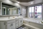 Master bathroom with tub and sink